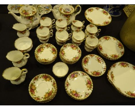 Sixty one pieces of Royal Albert Old Country Roses tea service, including teapot and cake stand