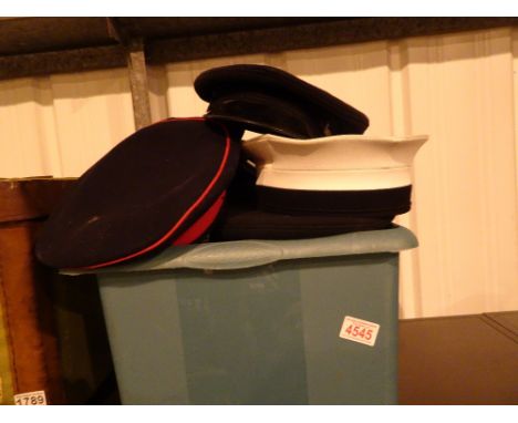 Box of mixed military hats including vintage examples 