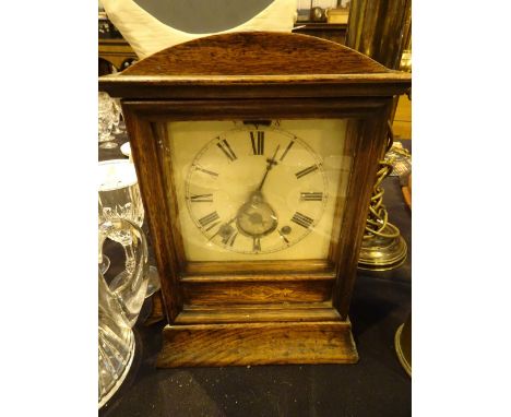 Oak cased alarm clock with double key and pendulum 