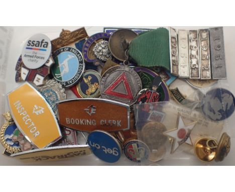 Box of enamel badges including Butlins
