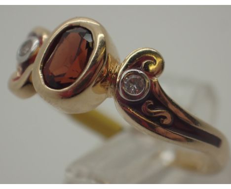 Ladies 14ct gold garnet and diamond fancy ring, size R