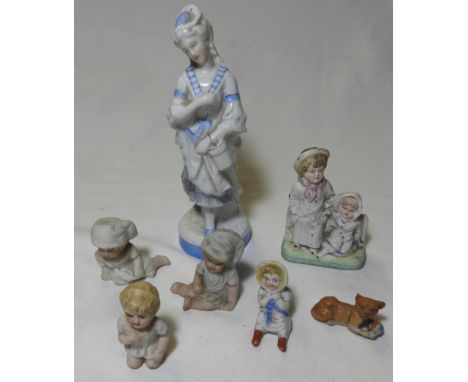 CERAMIC FIGURINE & 6 BISQUE VICTORIAN CAKE DECORATIONS 