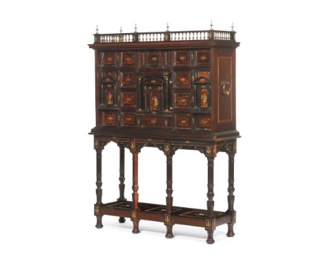 A Flemish cabinet on standIn rosewood and rosewood veneeredDrawer fronts lined with tortoiseshell with yellow metal appliques