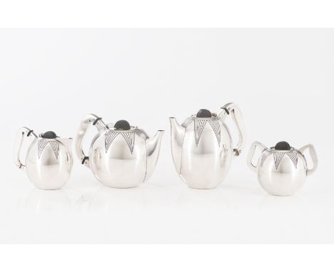 An Art Deco tea and coffee serviceComprising: a teapot; coffee pot; milk jug and sugar bowlSilver, fineness .833Wooden finial