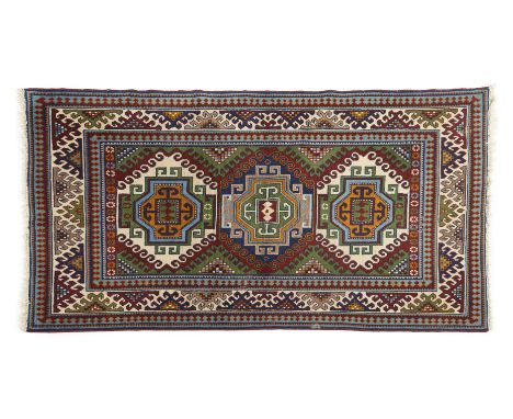 Sirvan carpet, Pakistanwool, featuring a geometric design in shades of green, white, yellow, blue, and burgundy240Ã—145 cm