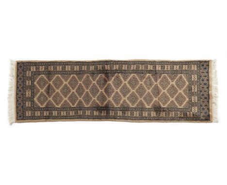 Kashmir carpet, PakistanWool and cotton, featuring a geometric design in shades of beige, blue, and salmon180Ã—65 cm