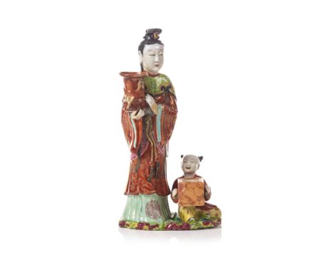 A Chinese porcelain candlestick "female figure" with inkwell "child"Chinese porcelain sculpture_x000D_Polychrome and gilt dec