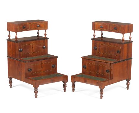 A pair of mahogany bedside step tablesIn mahogany and mahogany veneered with rosewood and kingwood stringingTwo drawers and a