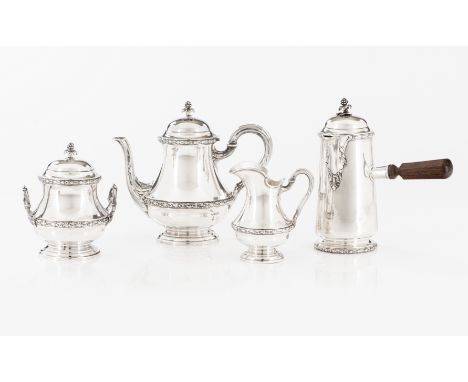 A tea and chocolate serviceComprising: Teapot, chocolate pot, milk jug and sugar bowlSilver, fineness .950With plain decorati