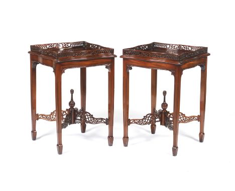 A pair of Chippendale style side tablesIn mahogany_x000D_Scalloped tops with gallery_x000D_Legs joined at centre by scalloped
