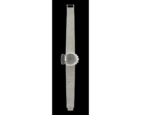 A PIAGET watch18K goldBezel set with 24 brilliant-cut diamonds weighing approximately 3.50 ct.Mechanical wind movementSwiss, 
