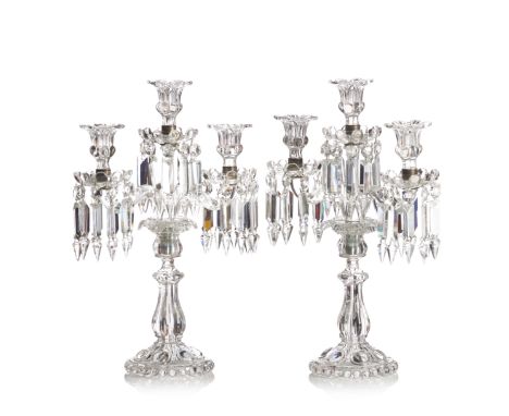 A pair of Baccarat three-light candelabra"Medaillon" modelIn moulded crystalWith dropsMarked on the baseFrance, 20th century(