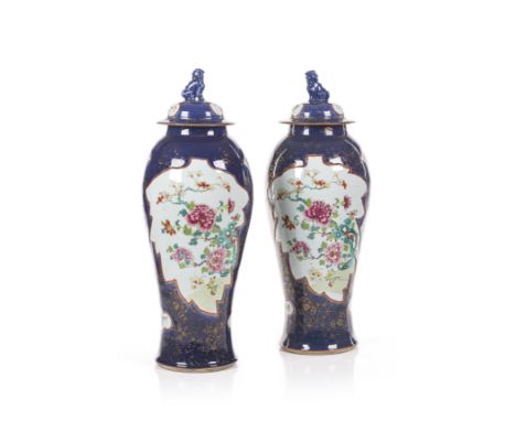 A pair of powder-blue and Famille Rose Chinese export porcelain covered jarsWith powder-blue ground and decorated with shaped