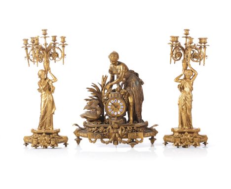 A "Leda and the swan" Napoleon III garnitureComprising of tabletop clock and pair of six branch candelabra_x000D_Gilt spelter