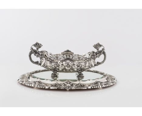 A silver centrepiece/flower holder with plateauSilver, fineness .833Chiseled and relief decoration with floral, foliage and s