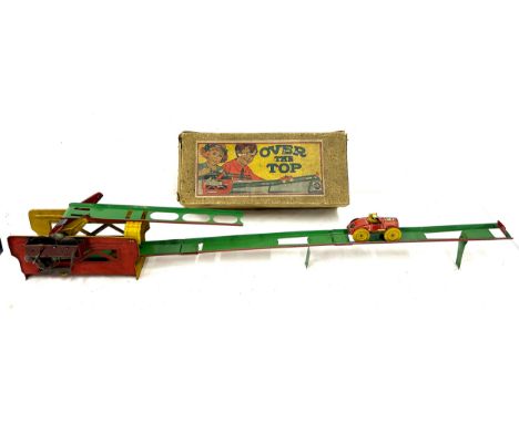 Vintage originally boxed mechanical clockwork  "Over The Top" tin toy 