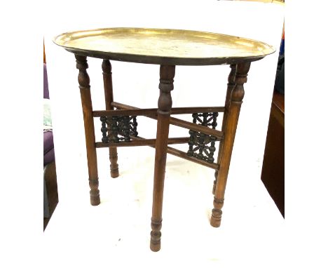 Vintage brass topped carved wooden table, diameter approx 21 inches 22.5 inches diameter 