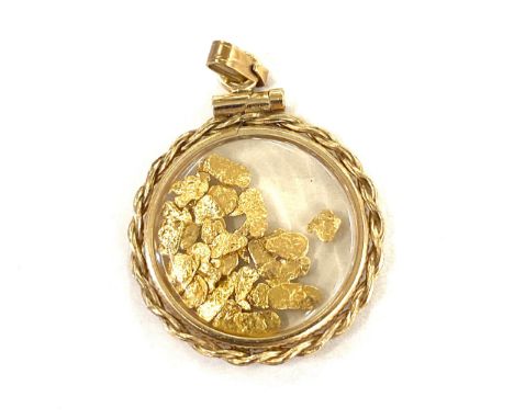 Vintage yellow metal pendant with gold flakes 
