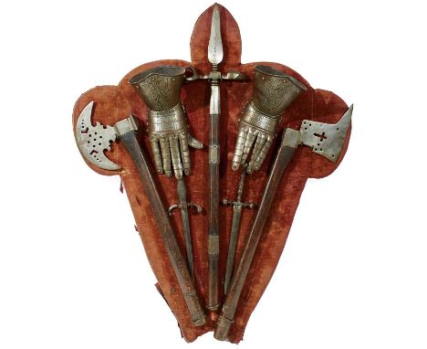 probably the work of Ernst Schmidt, the velvet covered shield-shaped oak frame mounted with a pair of etched articulated gaun