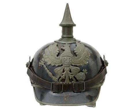 the steel skull with traces of original blued or blacked finish, grey painted mounts, Prussian helmet plate, spike finial on 