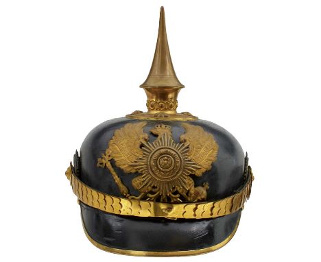 the black skull with gilt mounts to include state helmet plate, spike finial on circular base with star rivets, multi-piece I