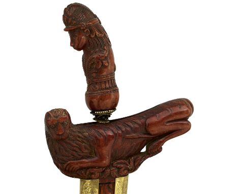 35.5cm straight pamor blade, characteristic well carved wooden hilt in the form of a figure in traditional dress, the brass w