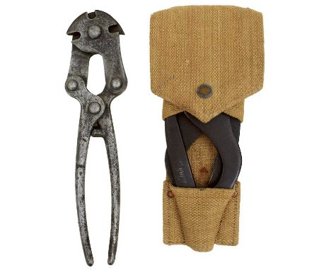 one dated 1915, the other dated 1917, the latter by Cheeseman with webbing holder, and an entrenching tool head. (3)