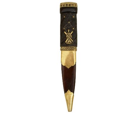 9cm fullered blade with faceted back edge, characteristic carved basket weave wooden hilt set with brass studs and the figure