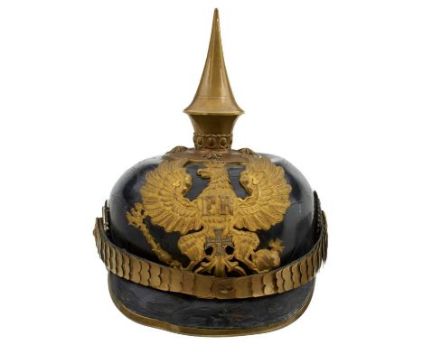 the black skull with gilt and brass fittings to include state helmet, spike finial with circular base and star rivets, Imperi