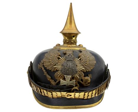 the black skull with brass and white metal mounts to include state helmet plate, spike finial with circular base and domed ri