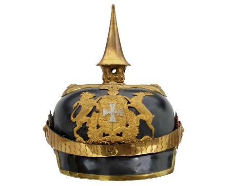 the black skull with gilt mounts to include state helmet plate, spike finial on quatrefoil base with star topped rivets, mult