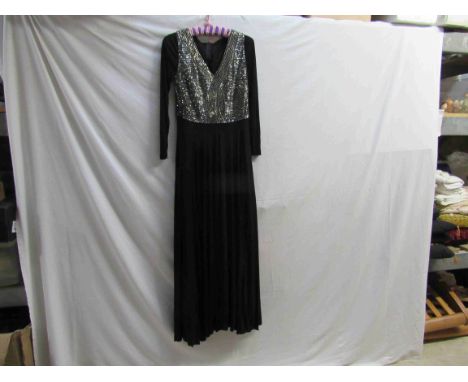 A Murray Abbeid full length black jersey cocktail dress with the bodice covered with silver coloured lozenge form bugle beads