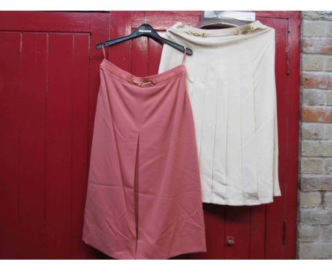 Celine Paris - two skirts, coral with gold metal bar detail at waist and cream wide pleat with gold metal and cream leather d