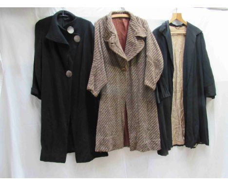 Three 1930's ladies coats, brown and a cream wool with a wide rounded lapel and stylized shaped sleeve, black bouchle wool wi