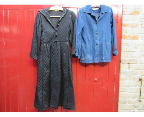 A SAINT LAURENT: rive gauche 1970's black quilted coat with a black leather trim, attcached hood, toggle fastening fron,t gat