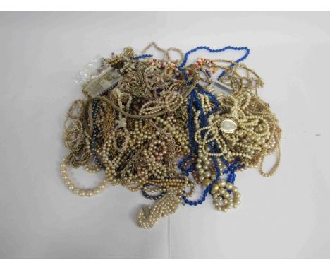 A large quantity of fashion costume jewellery, mainly pearl and yellow metal necklaces