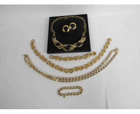 A "Grosse" yellow metal heavy link chain necklace and bracket, a yellow metal fancy link necklace and bracelet and a Monet ne