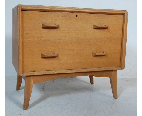 A retro vintage mid 20th century 1950s golden oak Brandon range G plan low boy chest of drawers having a bank of 2 spacious d