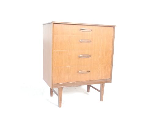 A retro vintage 20th century teak wood chest of drawers having a flared top over a bank of four drawers with lipped handles r