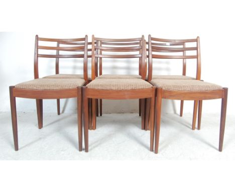 A set of six retro mid 20th century vintage teak wood G Plan Ernest Gomme dining chairs with upholstered seats raised on turn