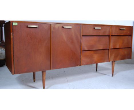 A retro vintage mid 20th century 1960s Avalon teak veneer sideboard having two banks of three shelves with recessed handles t