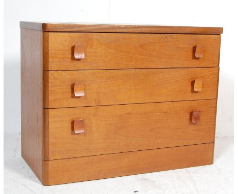 Stag - Cantata - A retro vintage teak wood lowboy chest of drawers having a bank of three spacious drawers with shaped wooden