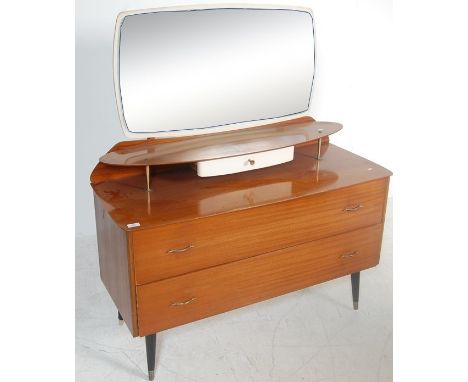 A vintage retro 20th Century dressing table having a suspended mirror to the top with glass shelf and drawer below, the chest