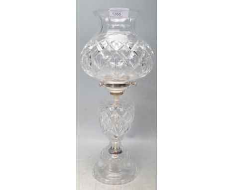 A vintage 20th century Waterford style lead crystal glass lamp having a waisted shade raised on a tapering base with lattice 