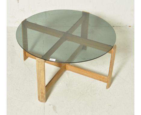 A vintage retro mid 20th century Danish inspired teak wood and glass coffee table / occasional table. The table having a circ