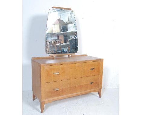 A vintage retro 20th century oak veneer dressing table chest. The dressing table having a shape mirror atop over two long dra