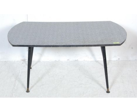 A vintage retro mid 20th century Formica / melamine coffee table. The coffee table having a black and white Formica rectangul