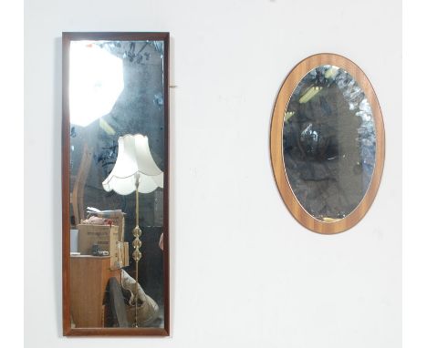 Two retro vintage mid 20th century 1970s teak framed mirrors. One mirror is of rectangular form and one is of oval form. Larg
