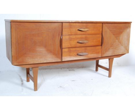 A vintage retro teak wood sideboard having a central bank of three drawers flanked by twin cupboard doors and raised on woode