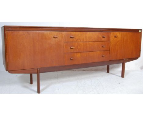 A retro vintage 1970s White and Newton teak wood sideboard having a bank of three drawers flanked by a single door cabinets r